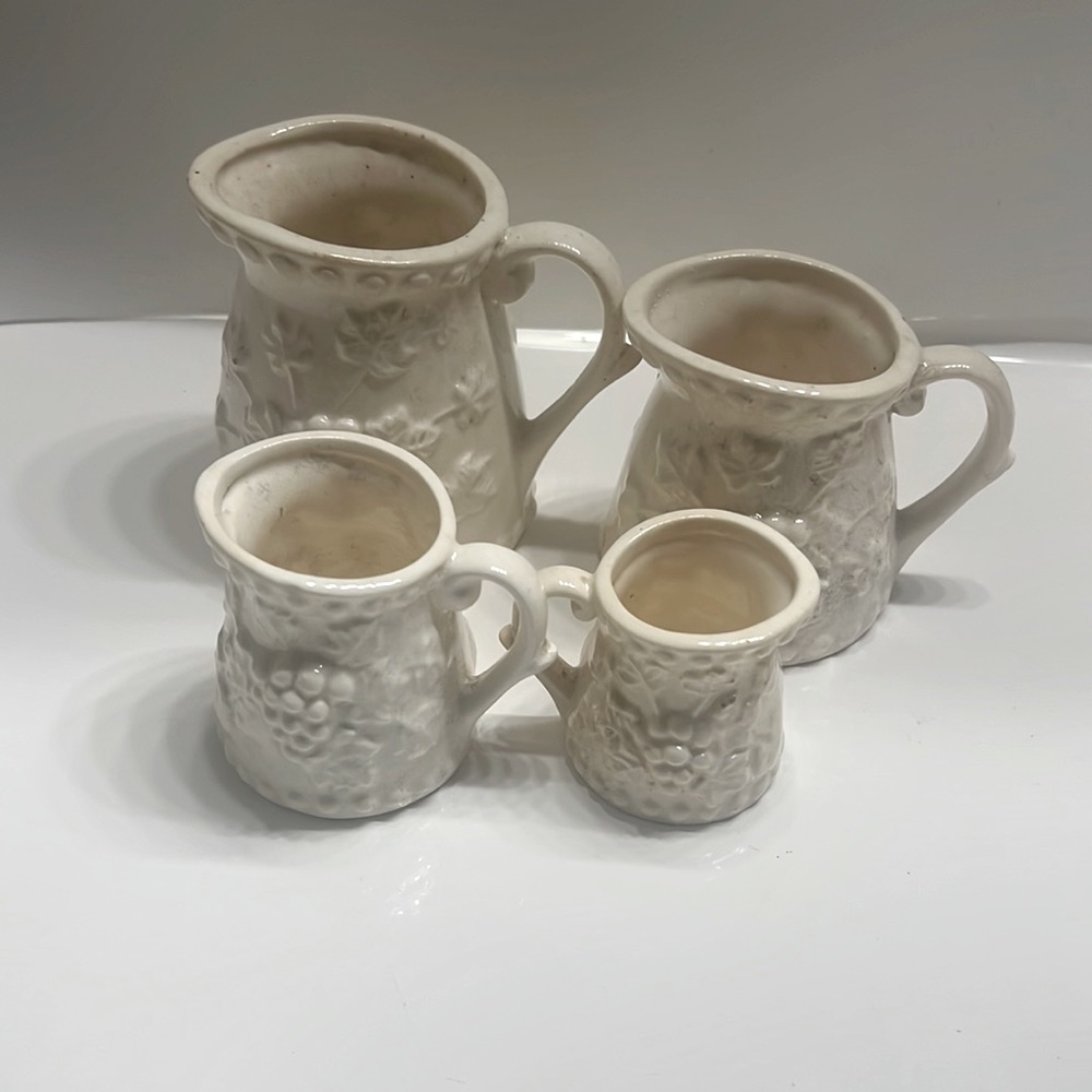 VINTAGE NAPCOWARE CERAMIC MEASURING CUP SET of 4-WHITE WITH GRAPE VINE PATTERN.